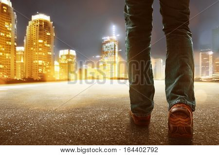 Man walking in the city at night