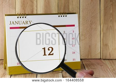 Magnifying Glass In Hand On Calendar You Can Look Twelfth Day Of Monthfocus Number Twelve In January