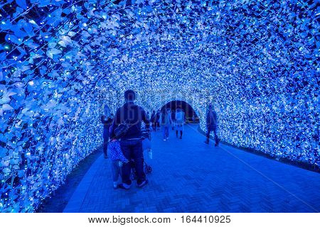 MieNagoya Japan - November 23 2015 : Unidentified tourist in blur motion visiting Nabana no sato winter illumination in Mie NagoyaJapan. It is one of Japan's largest illumination parks.