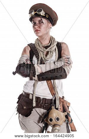 Nuclear post apocalypse life after doomsday concept. Grimy female survivor in tatters. Studio portrait on white background