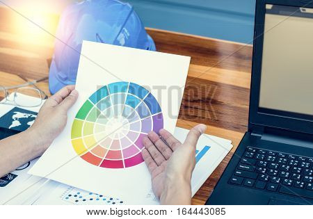 Business Workers Discussing Digital Graphs And Diagrams Indicating Progres.