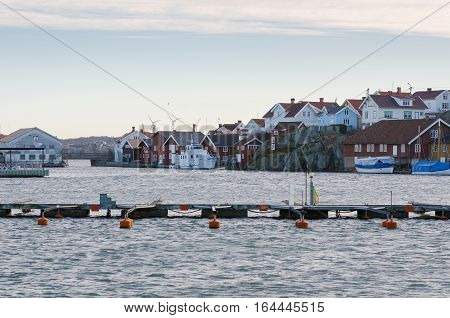 one harbour in sweden on the westcoast a fishingboat and many other boat