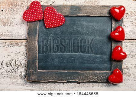 Happy Valentine's Day Love Chalkboard for restaurant menu board with wooden frame and hearts with copy space