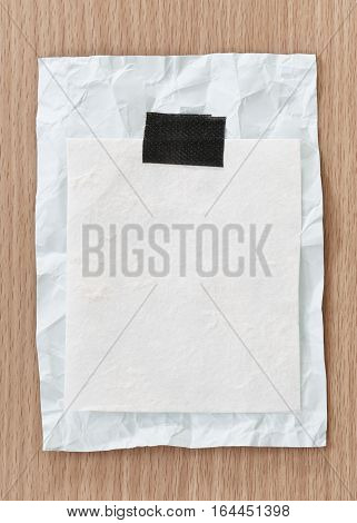 Note paper crumpled of empty and copy space on wooden backgroundYou can input the message text in picture.
