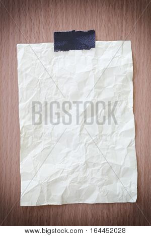 Yellow notepad paper crumpled of empty and copy space on wooden backgroundYou can input the message text in picture.