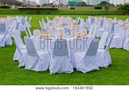 gorgeous wedding chair and table setting for fine dining at outdoors