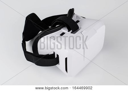 Virtual reality VR glasses or goggles isolated on white background with mirror reflection. Closeup product photograph. Computer simulated reality concept image with copy space 3D