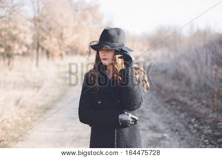 Portrait of a young woman wearing a hat
