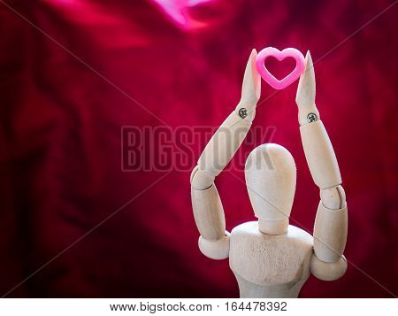 Still Life Wooden Puppet And Pink Heart.