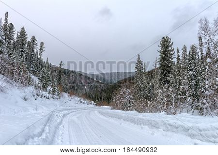 Winter road in Khakasia .Siberia mountains in snow