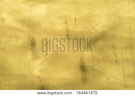Gold texture with kinks and scratches abstract background. Golden background