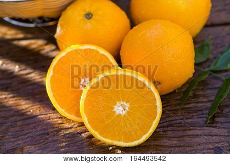 Sweet Fresh Oranges In Natural Light On Old Wood