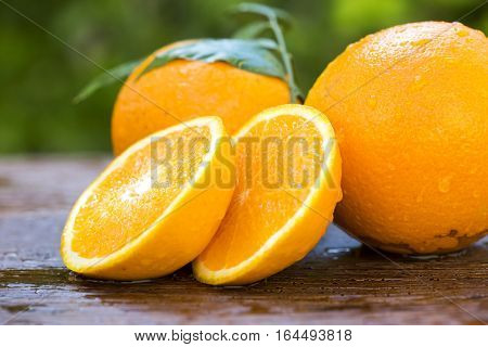 Sweet Fresh Oranges In Natural Light On Old Wood