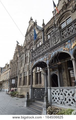 Historic town hall with flags and gold jewelry in Voerne Belgium