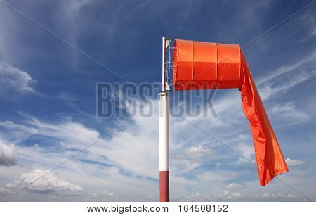 Wind sock of equipment check the wind blow direction in day time on blue sky background.