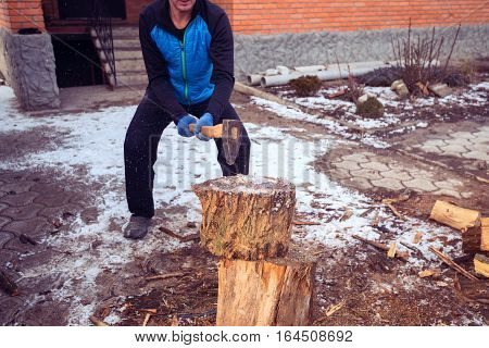 Sporty Man Chops Wood On The Farm