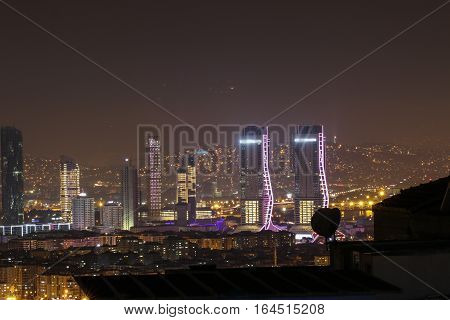 IZMIR, TURKEY - DECEMBER 31, 2016: Landscape of the skyscrapers of izmir at night with Folkart  towers construction. Night view.