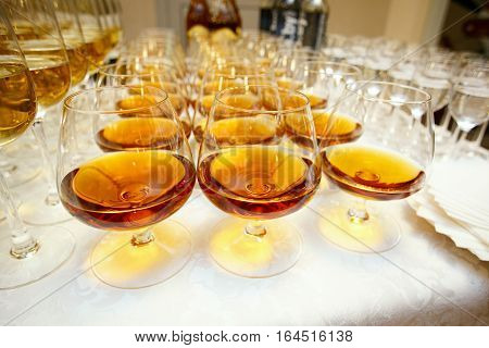 glasses with cognac or brandy on event catering