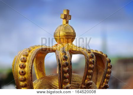 Skeppsholmsbron (Skeppsholm Bridge) with Golden Crown on a bridge in Stockholm Sweden