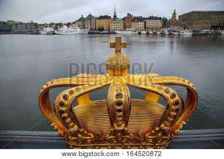 Skeppsholmsbron (Skeppsholm Bridge) with Golden Crown on a bridge in Stockholm Sweden