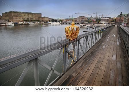 Skeppsholmsbron (Skeppsholm Bridge) with Golden Crown on a bridge in Stockholm Sweden