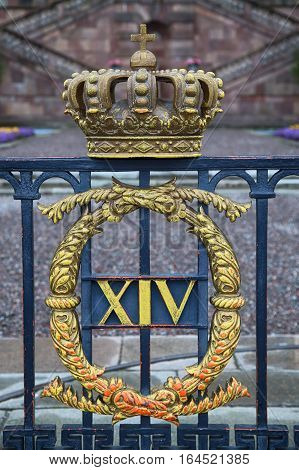 The fence of the Royal Palace with crown in Stockholm Sweden