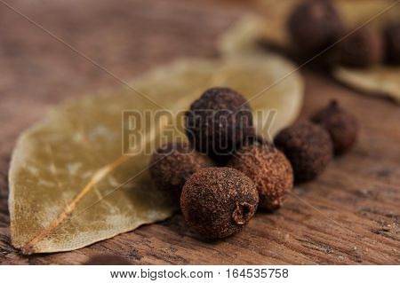 The grains or granules of peppers on wood and