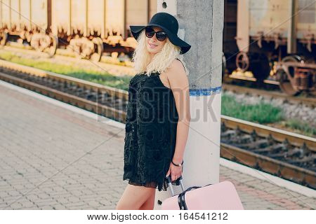 beautiful girl at raiway station. uses communication