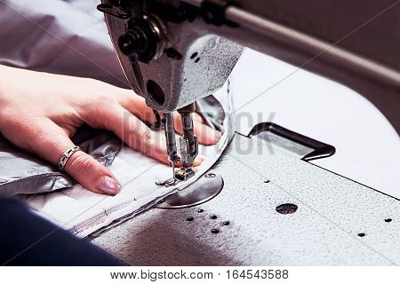 sewing machine with the processing in progress