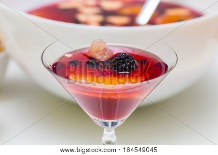 punch drink sangria with berries and orange