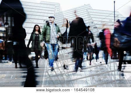 multi exposure image of crowds of people and office buildings