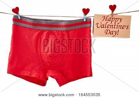 Men's underwear on white backdrop. Valentine's Day card on rope. Useful and simple gift.