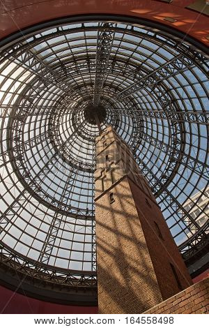 Melbourne Australia - February 2015: Melbourne's Shot Tower which was built on the site in 1888 is an iconic building contained underneath a massive glass dome at the Melbourne Central shopping centre