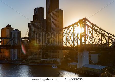 Sunset flare, Brisbane Cityscape and Story Bridge silhouette