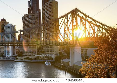 Brisbane cityscape and sunset flare through Brisbane Story bridge