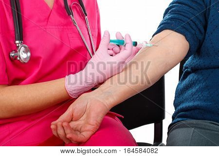 Close up picture of an elderly woman receiving an injection. Everything sterilized