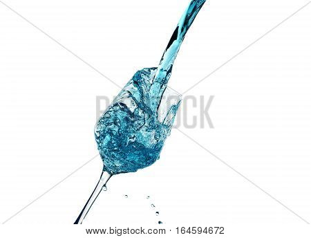 Creative splashing of blue water in the glass Isolated on white