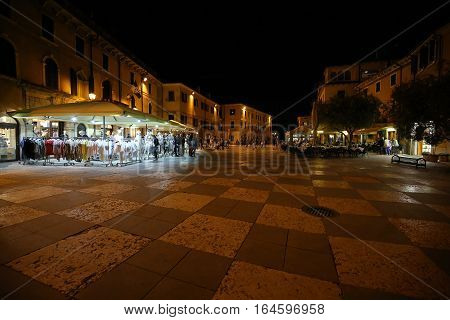 LAZISE ITALY - MAY 5 2016: Shops bars and restaurants in Lazise at Garda Lake. Italy