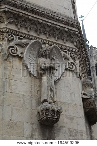 angel with wings. Detail architecture Basilica of Notre-Dame de Fourviere is located on the hill of Fourviere. Lyon. France.