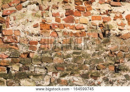 Old damaged brick wall under construction background
