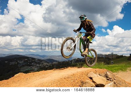 Mt Buller, Australia - January 4, 2017: Downhill mountain bike riders attempt the ABOM and International tracks on January 4, 2017 in Mt Buller, Australia