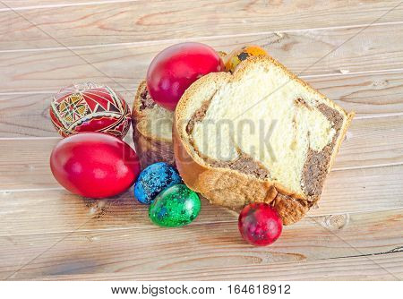 Cakes Cozonac With Smashed Nuts, Traditional Colored Easter Egg, Wood Background
