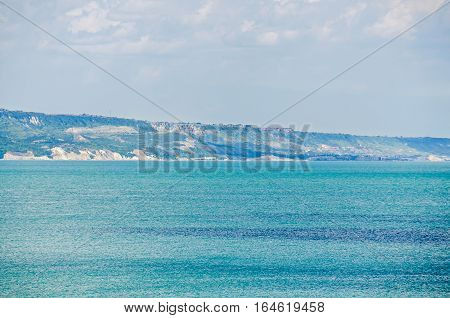 Albena, Bulgaria - June 13, 2016. View Of The Black Sea Shore, Green Hills, Blue Clouds Sky. City Ba