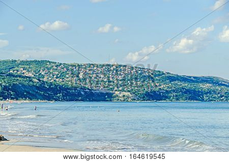Albena, Bulgaria - June 13, 2016. The Seaside Of Black Sea, Green Hills With Houses, Blue Clouds Sky