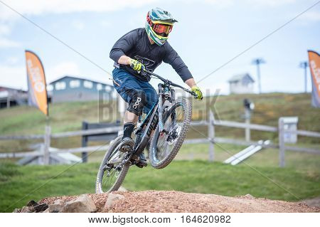 Mt Buller, Australia - January 5, 2017: Downhill mountain bike riders attempt the ABOM and International tracks on January 5, 2017 in Mt Buller, Australia