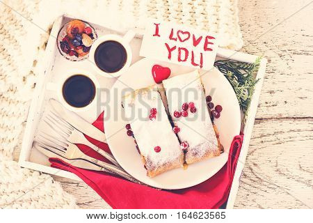 Strudel and coffee on a tray. Breakfast. Breakfast in bed breakfast for Valentine's Day