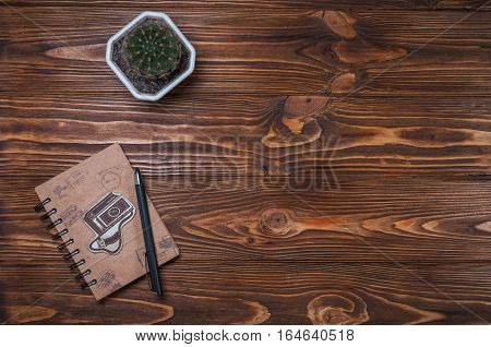 notebook with a pen on the table