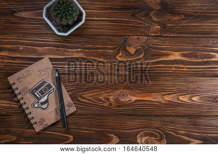 notebook with a pen on the table