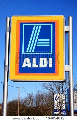 Carmarthen, Wales, UK - January 2, 2017:  Aldi logo advertising sign outside its retail supermarket stores in the city centre