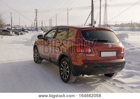Nissan Qashqai in red color. This is crossover that combines modark design and compact hatchback refinement with functionality